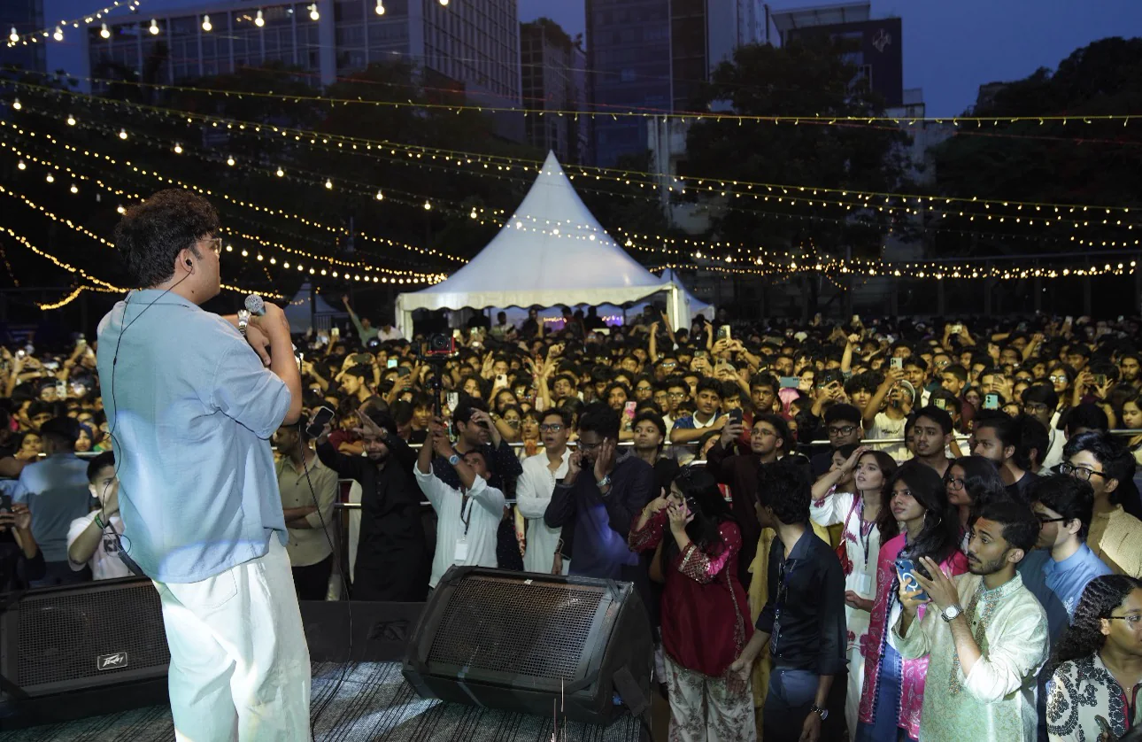An artist performing to the Eid-E-Bahar crowd from the stage